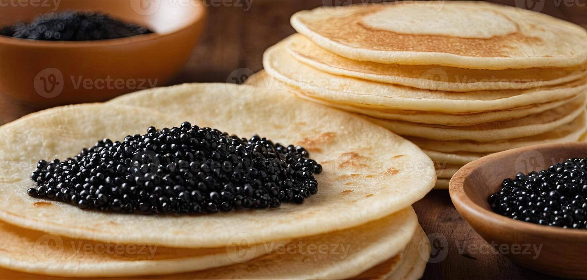 Pancakes with caviar for breakfast highlight luxury morning meal. Golden stack of thin pancakes or blini topped with black caviar photo