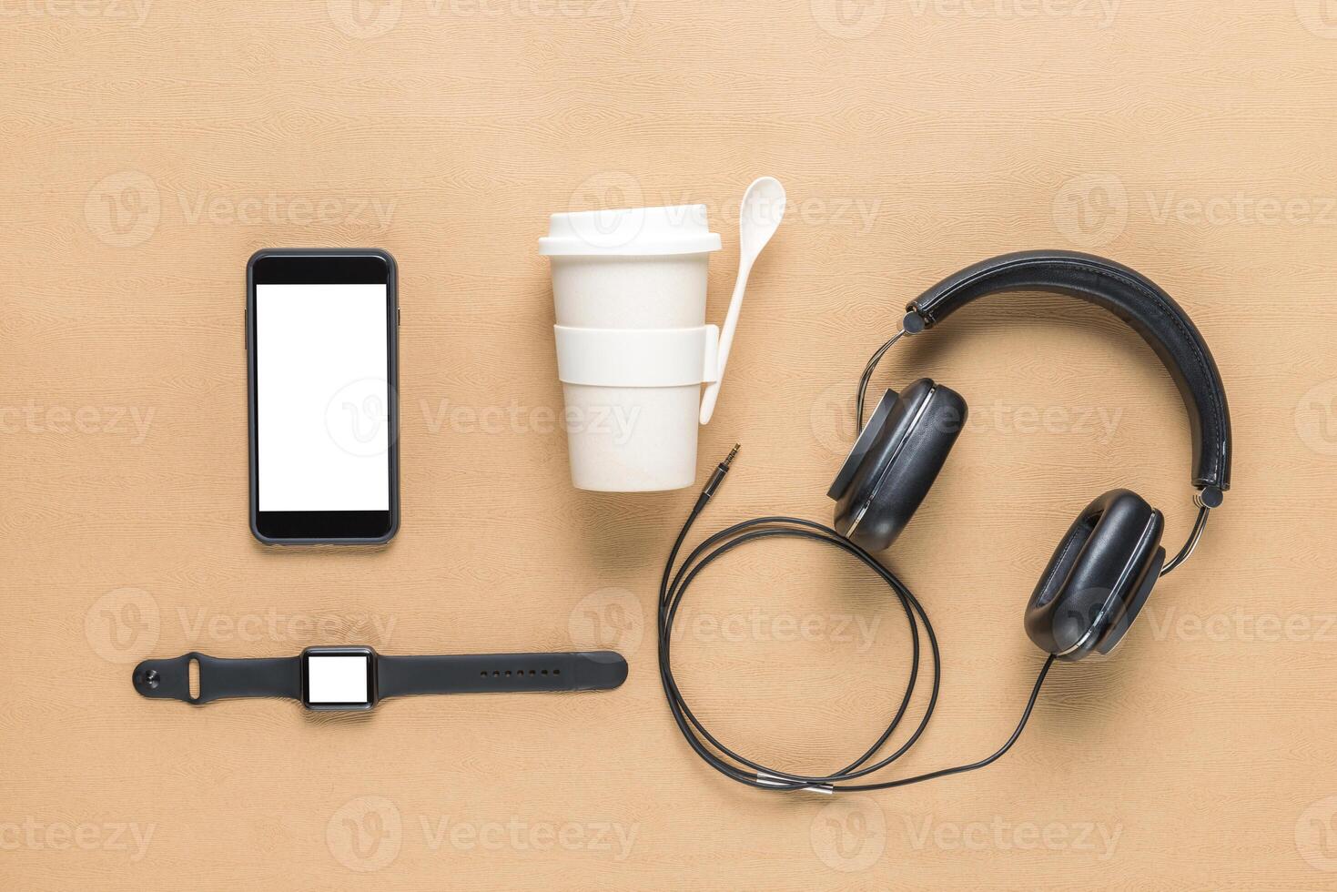 Business concept. Top view of earphones, watch, smartphone on color background photo