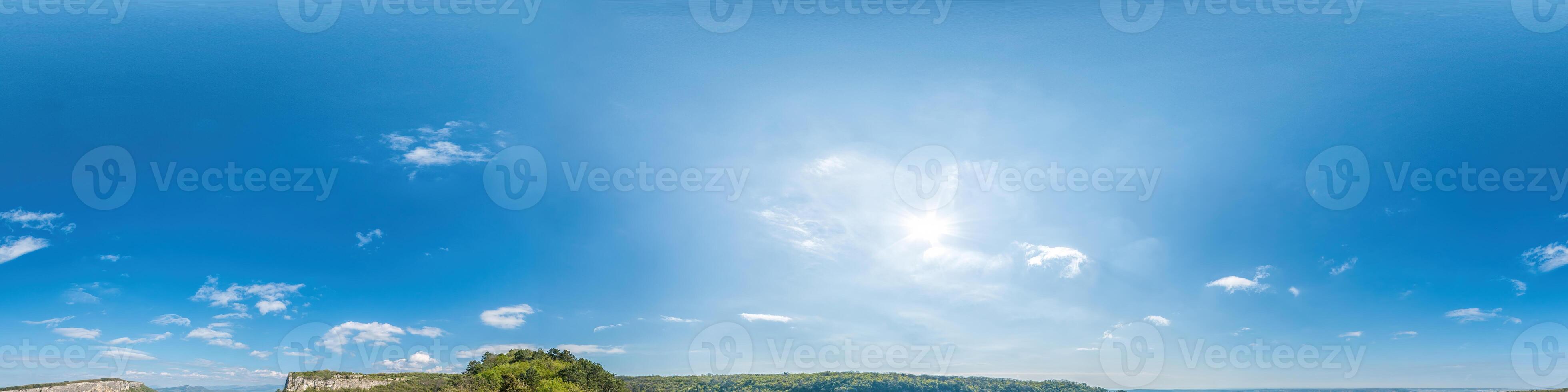 Blue sky with light clouds Seamless panorama in spherical equirectangular format with complete zenith for use in 3D graphics, game and for composites in aerial drone 360 degree panoramas as a sky dome photo