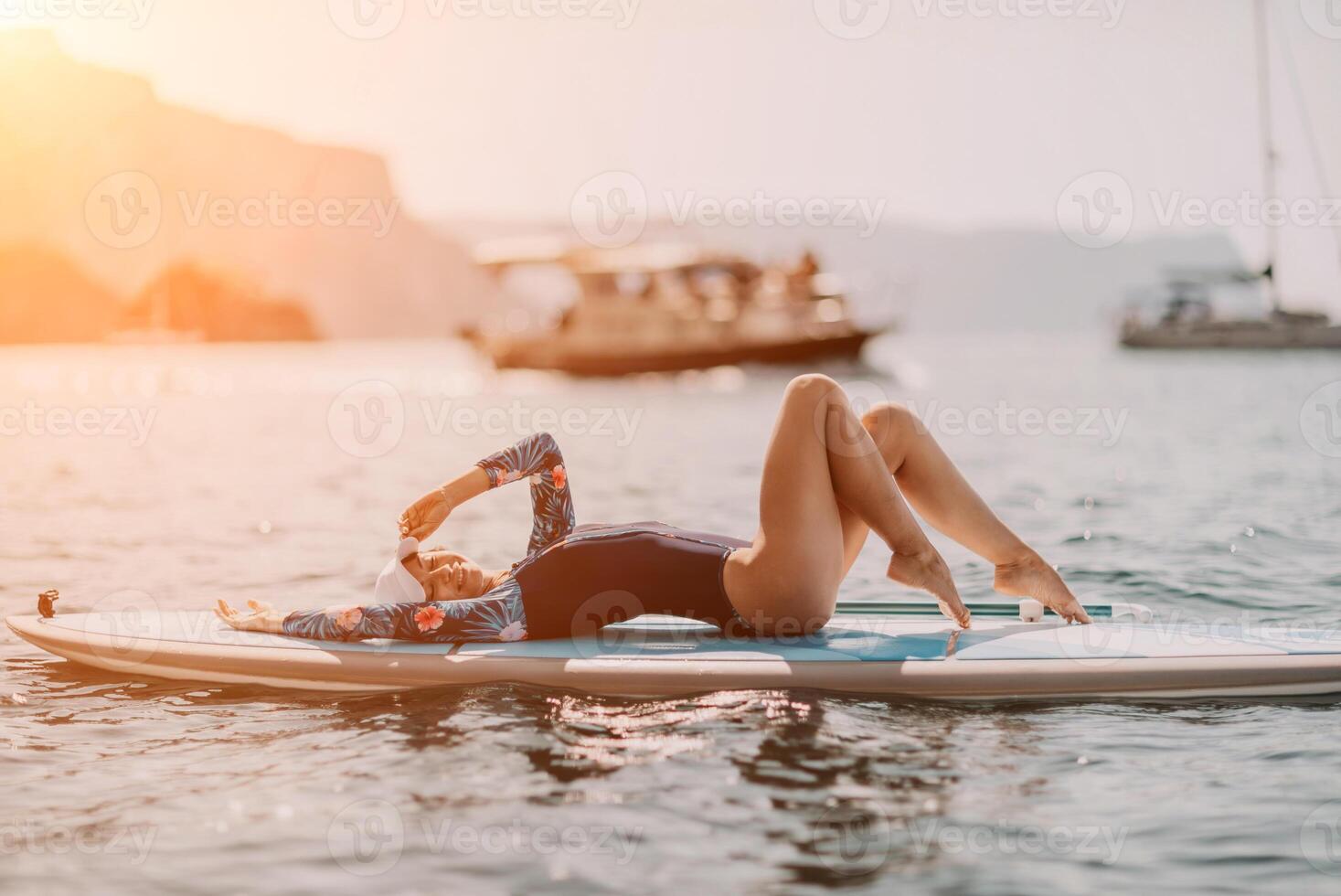 Woman sup yoga. Middle age sporty woman practising yoga pilates photo