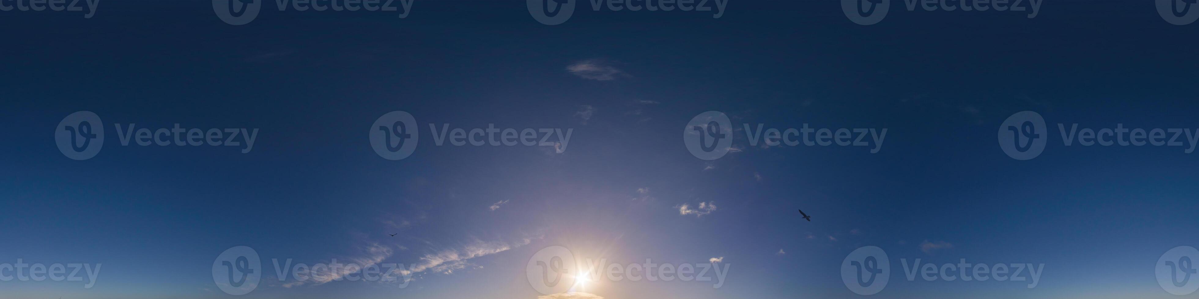 Dark blue sunset sky panorama with Cirrus clouds. Seamless hdr pano in spherical equirectangular format. Complete zenith for 3D visualization, game and sky replacement for aerial drone 360 panoramas. photo