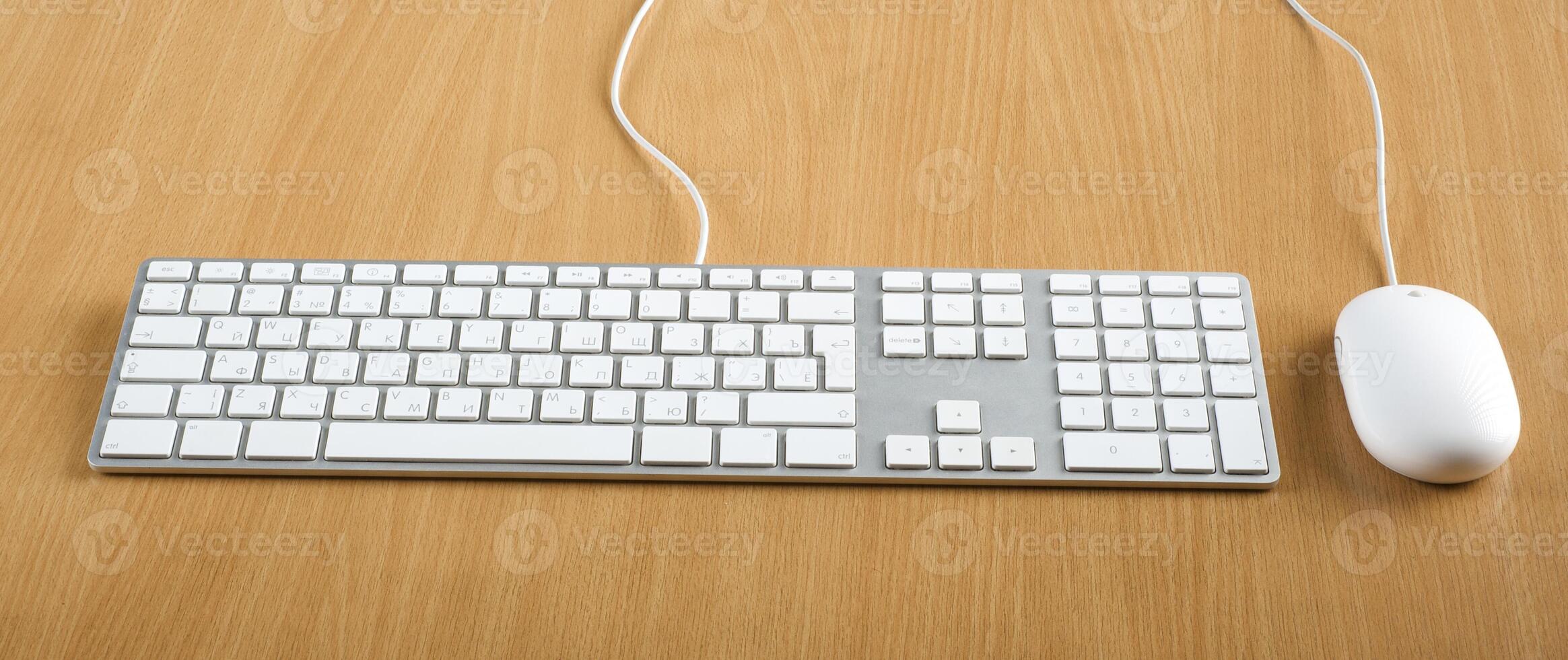 Modern aluminum computer keyboards and mouse for computer photo
