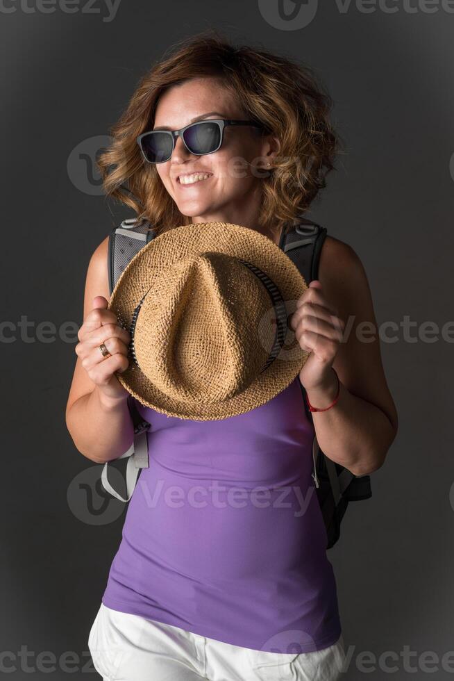 Young woman with hat and accessories in studio. photo