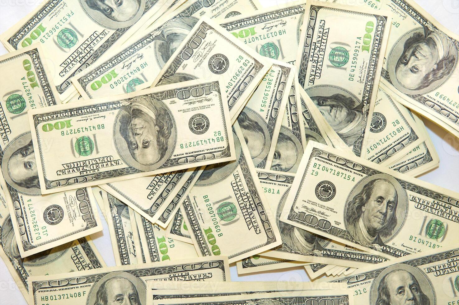 American dollars arranged in stacks of 100 bills each photo