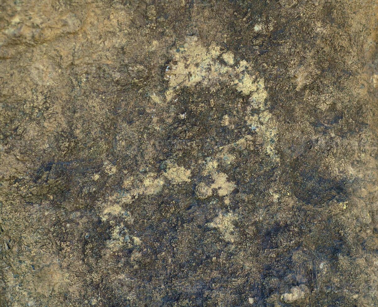 Ancient figures on the the stone photo