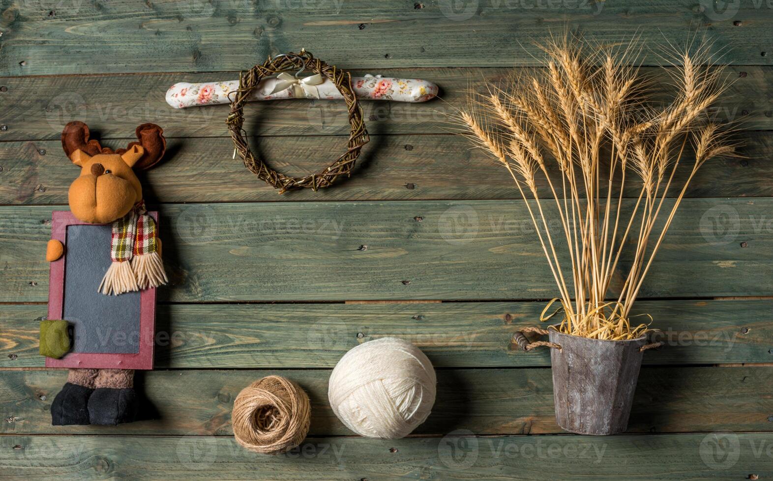 Wheat Ears on the Wooden Table. Sheaf of Wheat over Wood Background. Harvest concept. photo