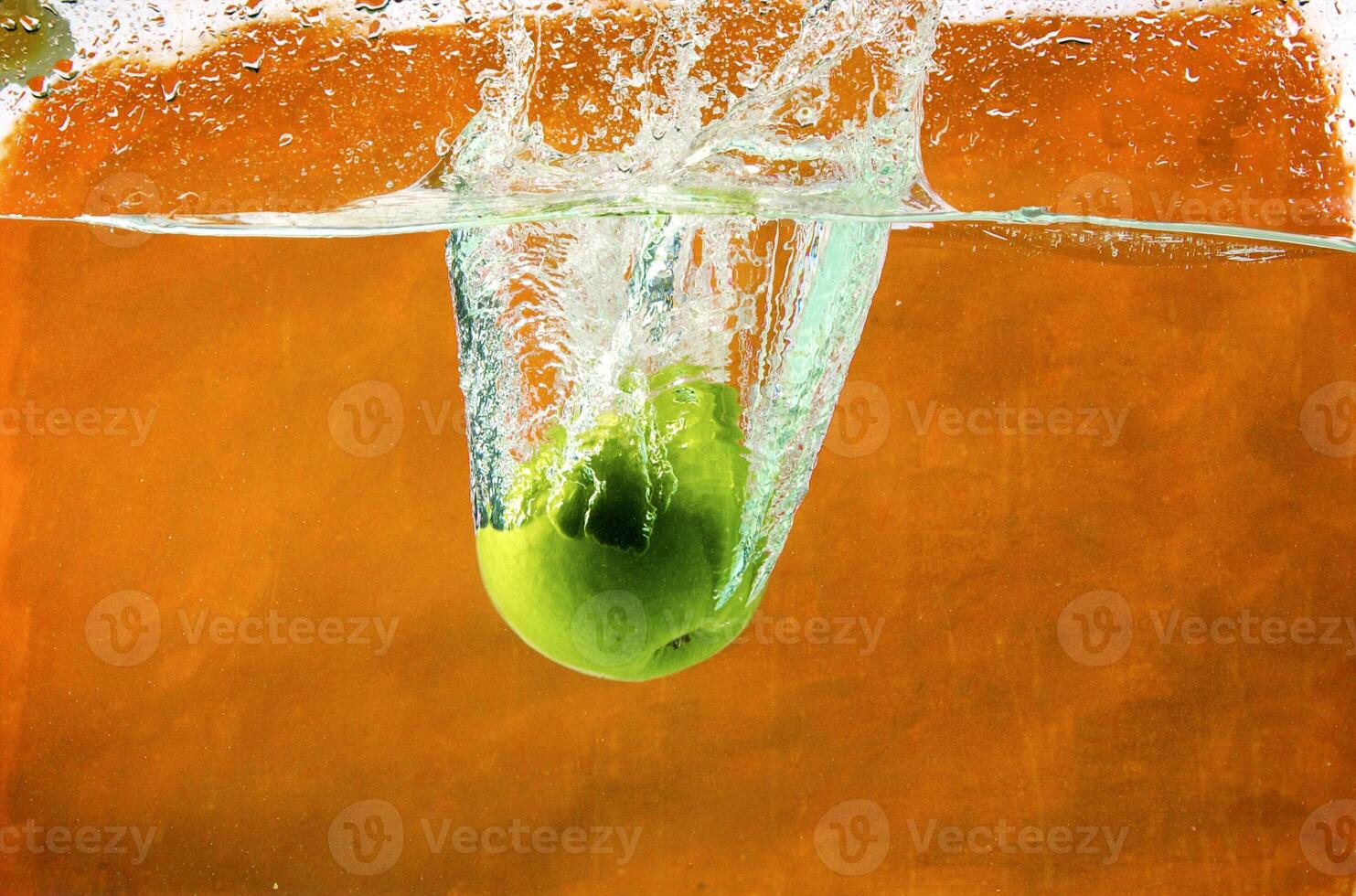 Green apples in water photo