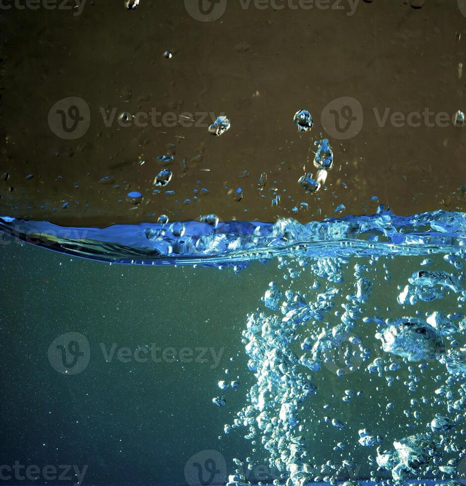Fresh water with waves and bubbles photo