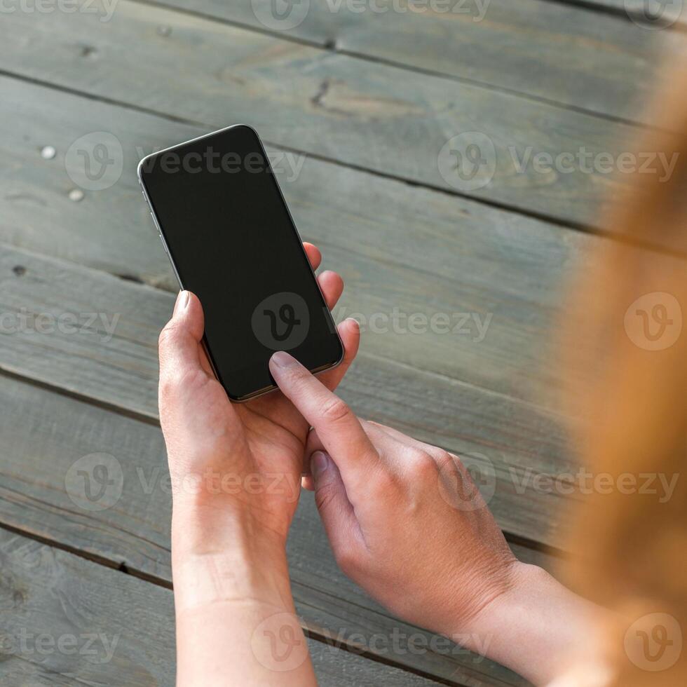 Hands holding phone photo