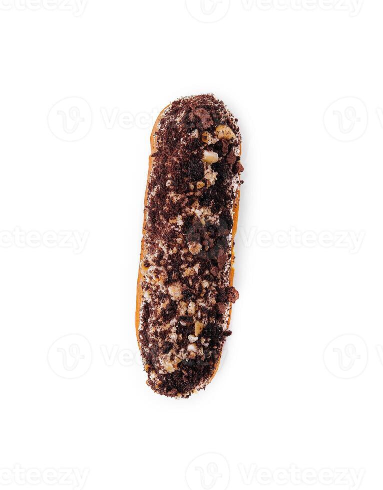 eclair with chocolate and nuts on a white photo