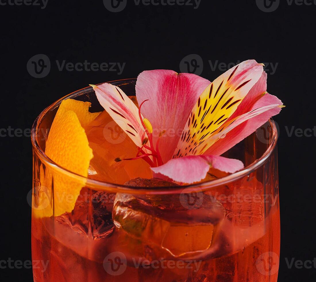 Champagne cocktail with ice and flowers photo