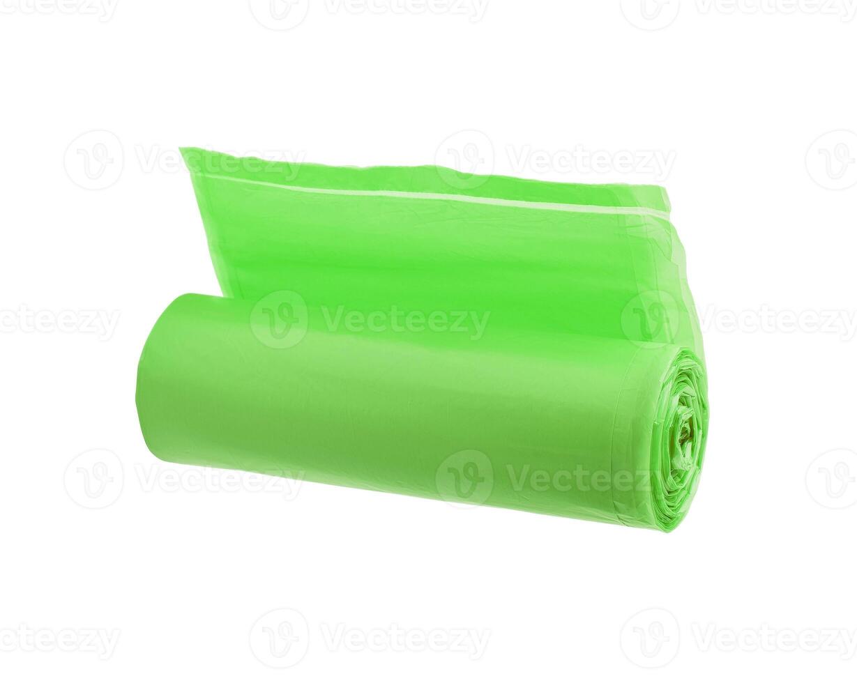 Green roll of garbage bags isolated on white background photo