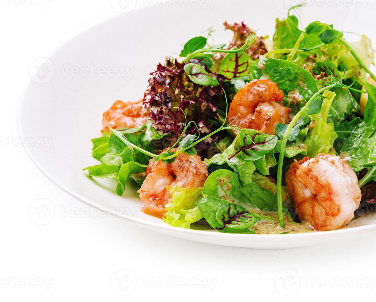 Prawn salad on white plate isolated photo