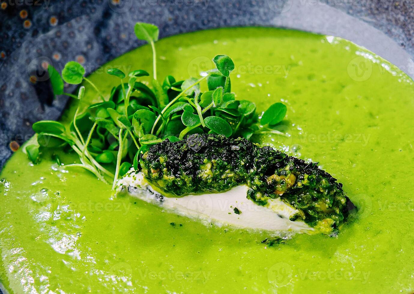Broccoli, spinach cream soup in a bowl photo