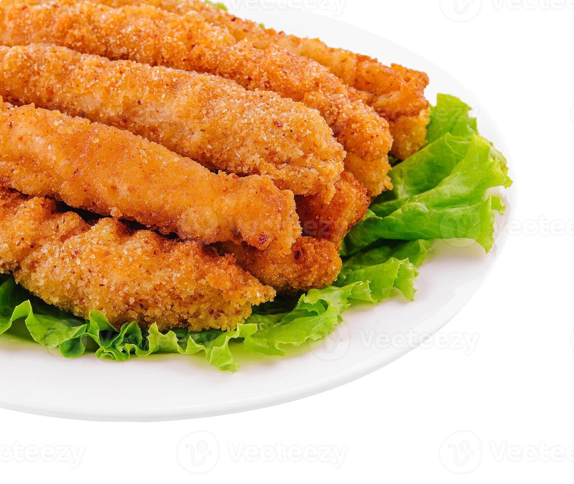 chicken nuggets on lettuce isolated on white photo