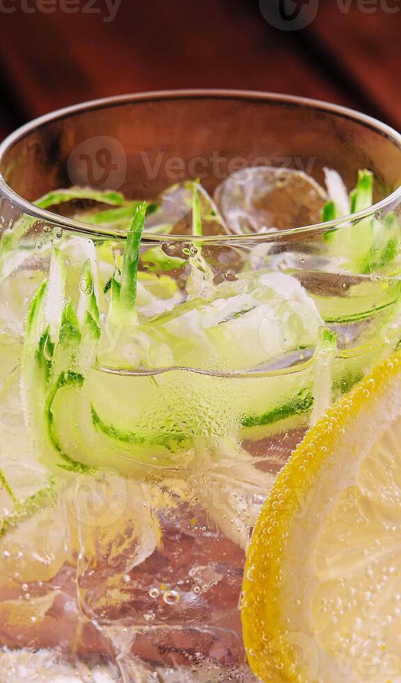 Summer refreshing non alcoholic cocktails with lemon and cucumber photo