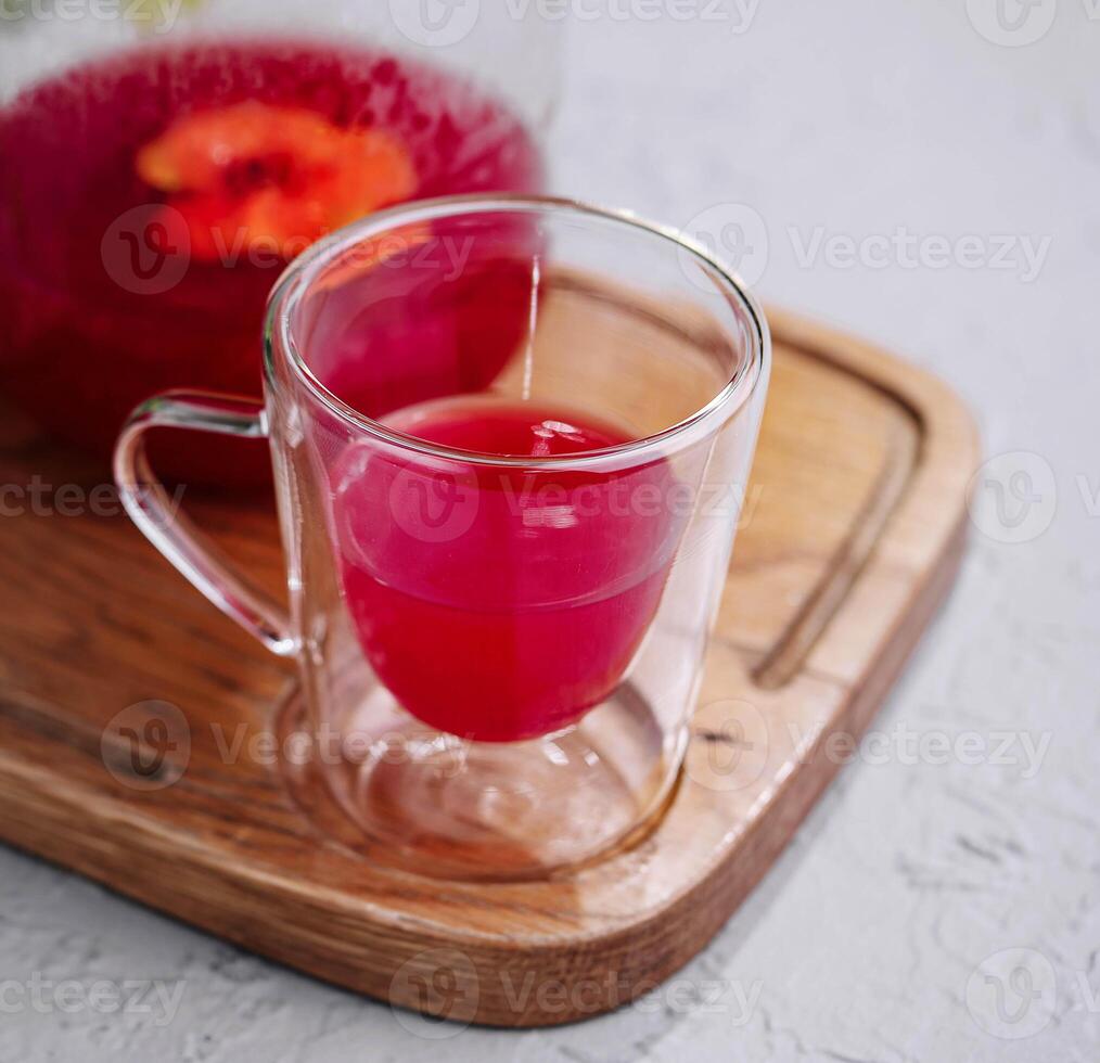 Raspberry Tea in Pitcher and Glass photo