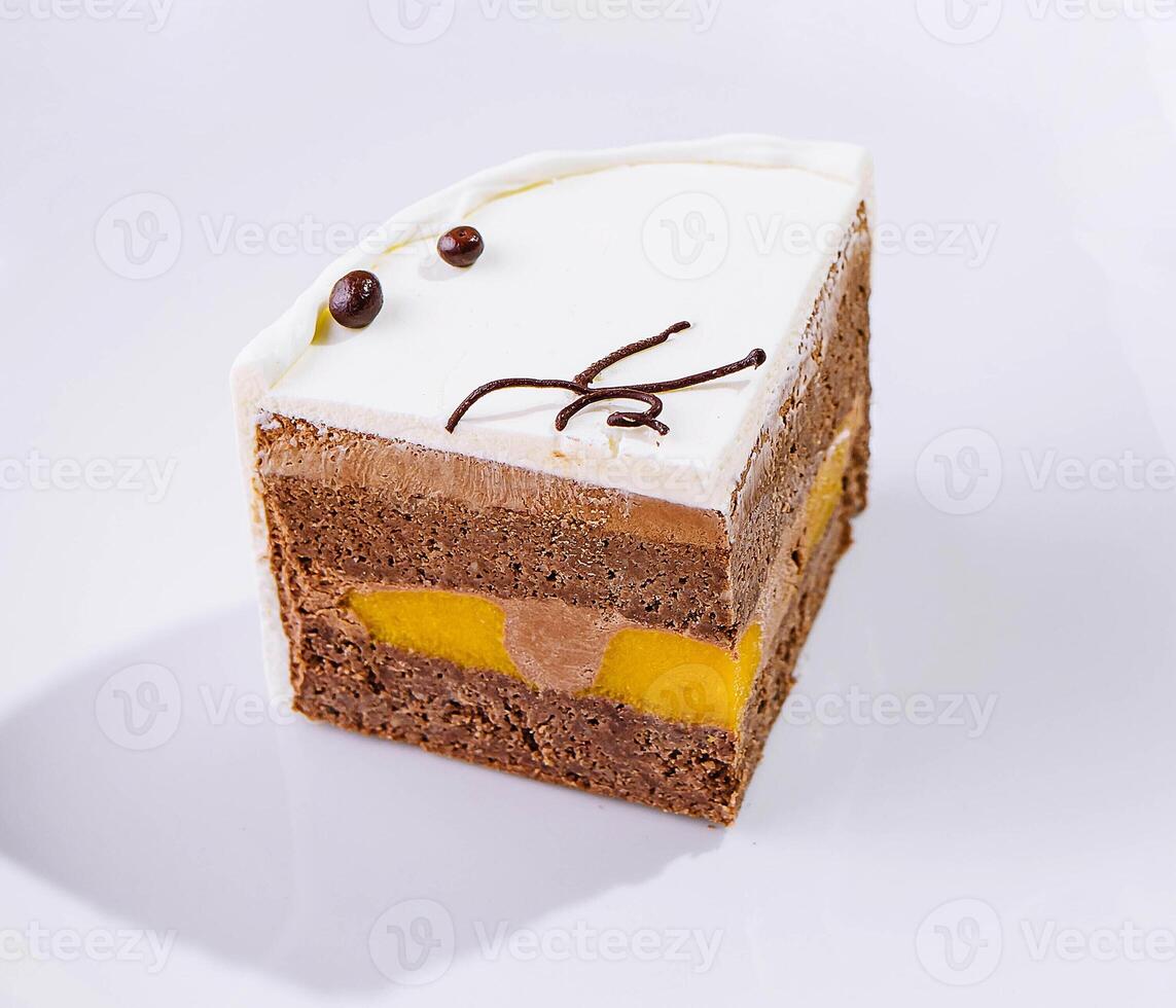 top view of a cream cake on white plate photo