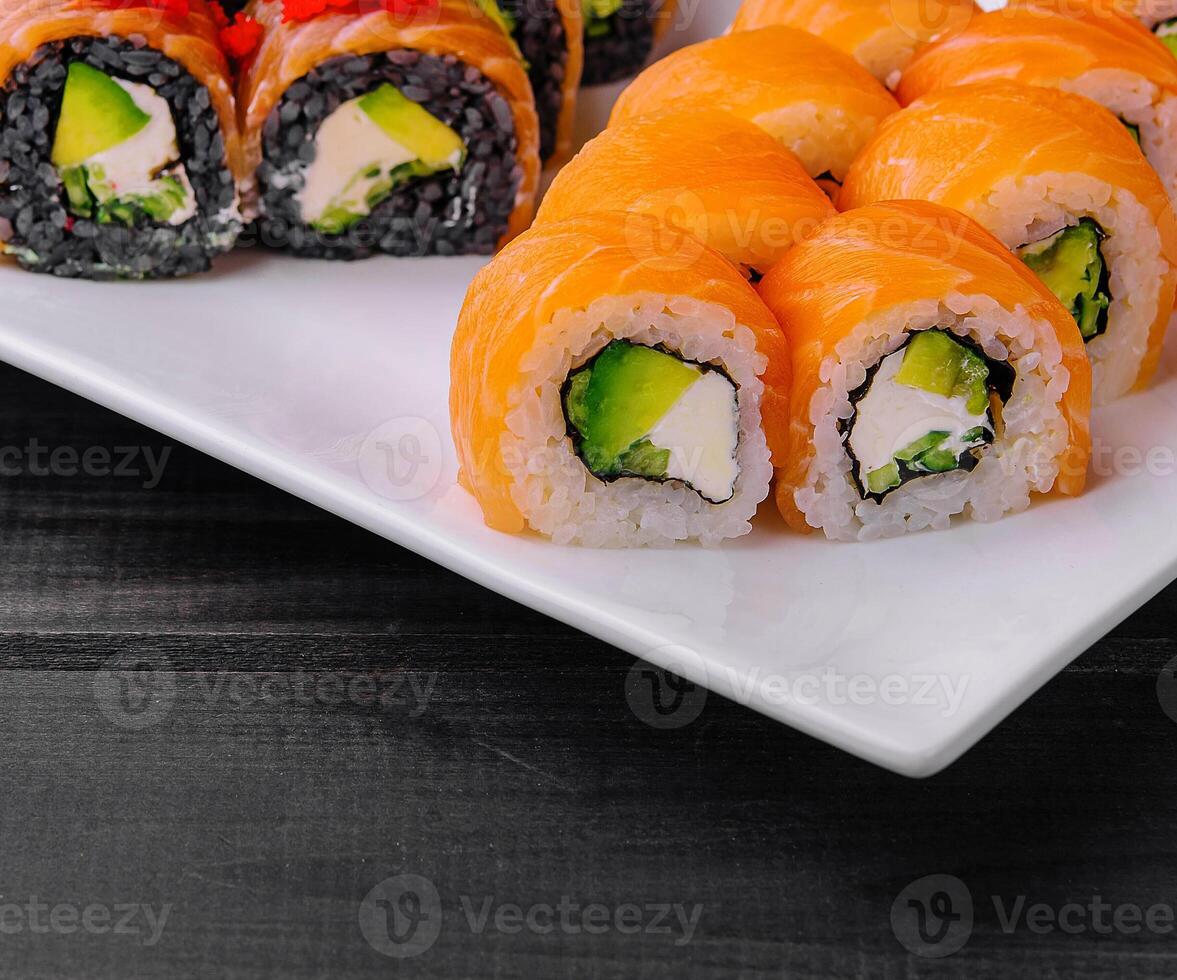 varios Philadelphia sushi rolls with salmon on a plate photo
