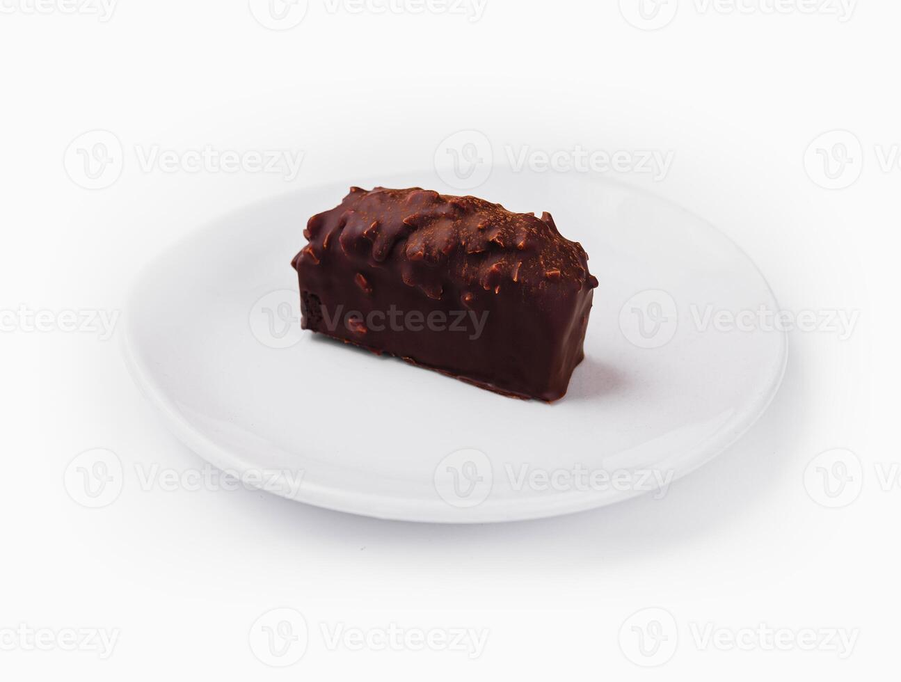 Chocolate bar on white plate photo