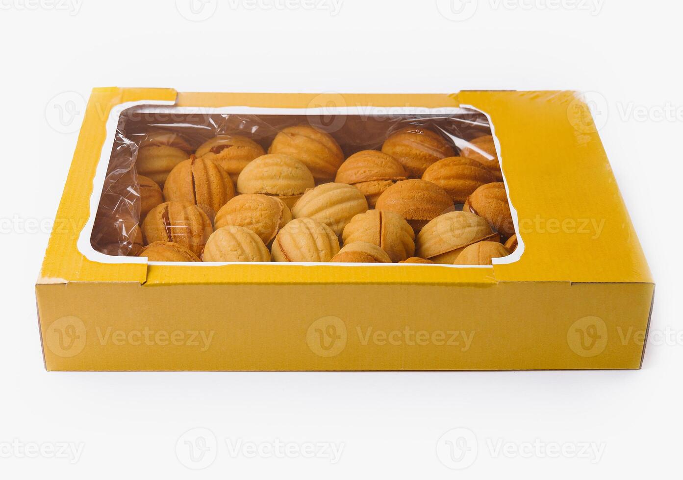Box of freshly baked cookies isolated on white photo