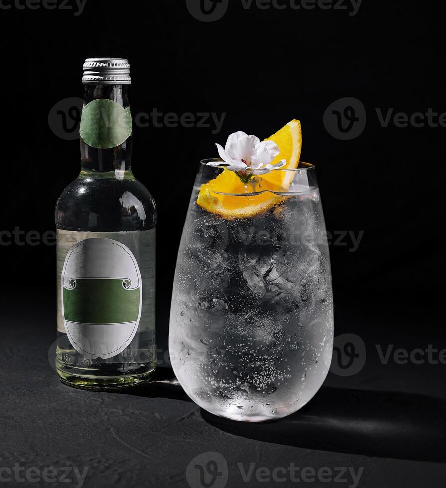 Refreshing gin and tonic cocktail with citrus garnish photo