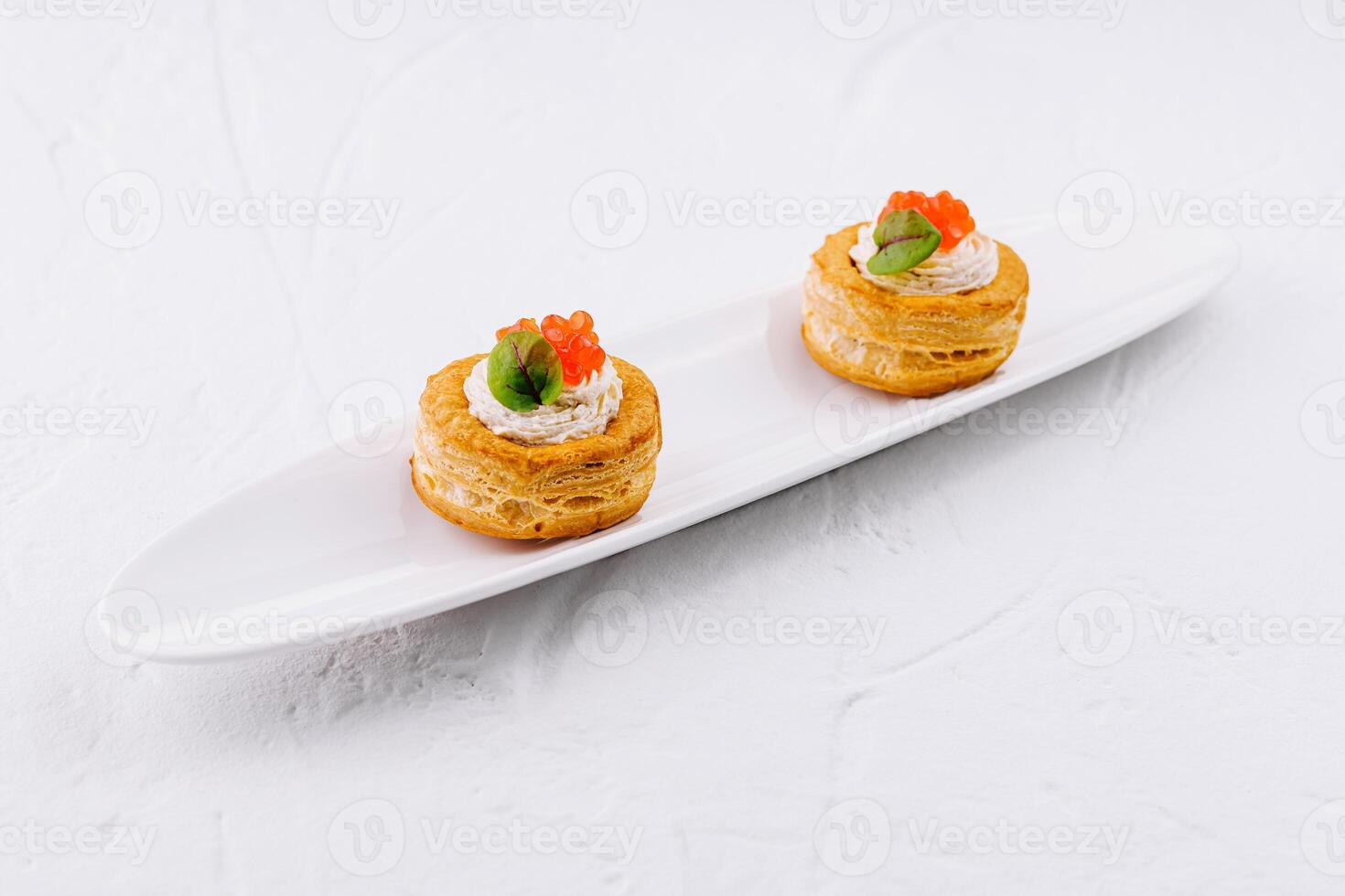 Gourmet vol-au-vent appetizers with salmon caviar photo