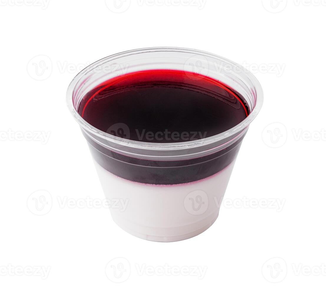Layered berry panna cotta in plastic cup isolated on white photo