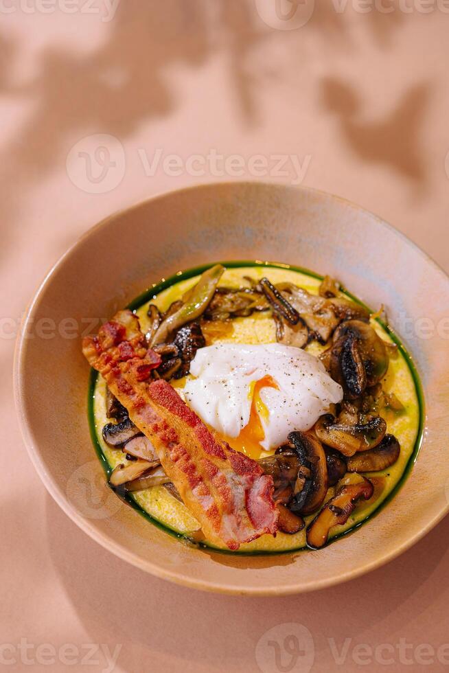 Gourmet breakfast with poached egg and bacon photo