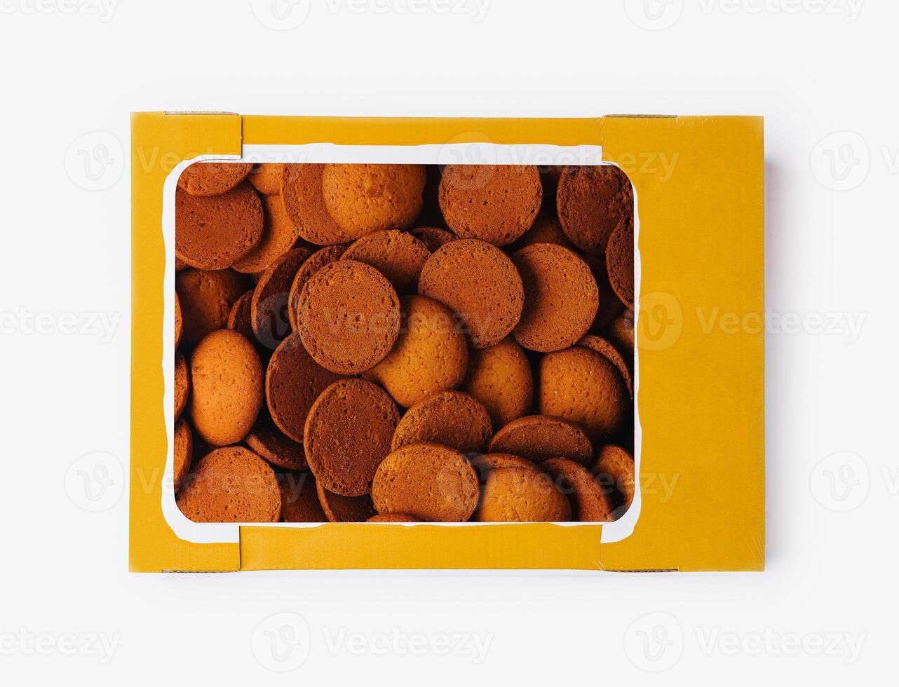 Box of round brown cookies on white background photo