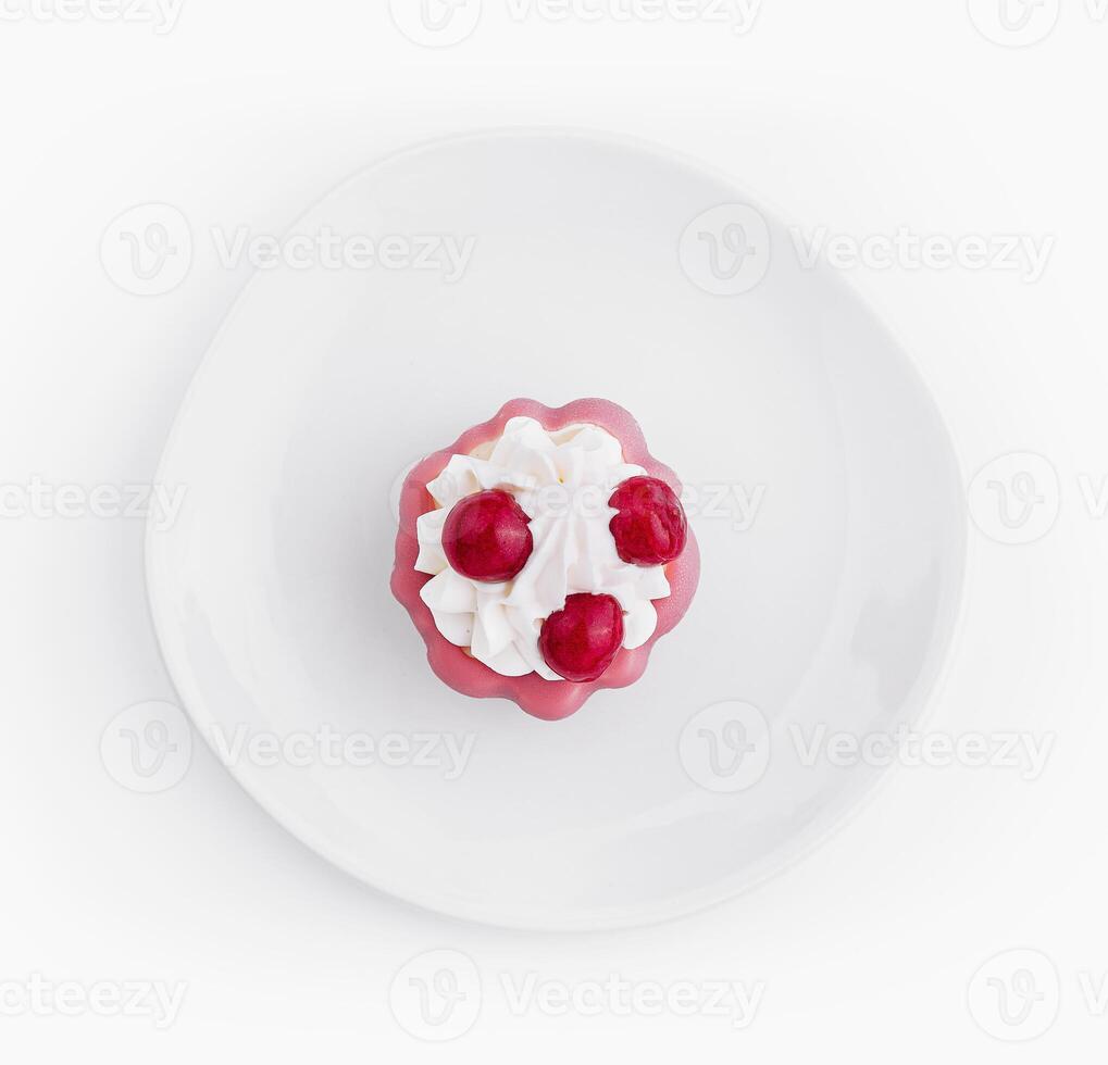 Top view of raspberry dessert on white plate photo