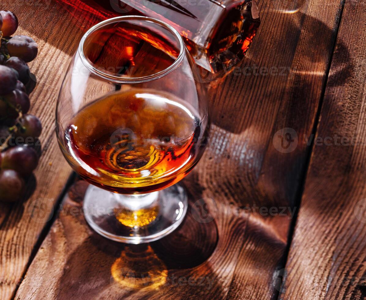 Luxurious spirits and charcuterie spread on wooden table photo