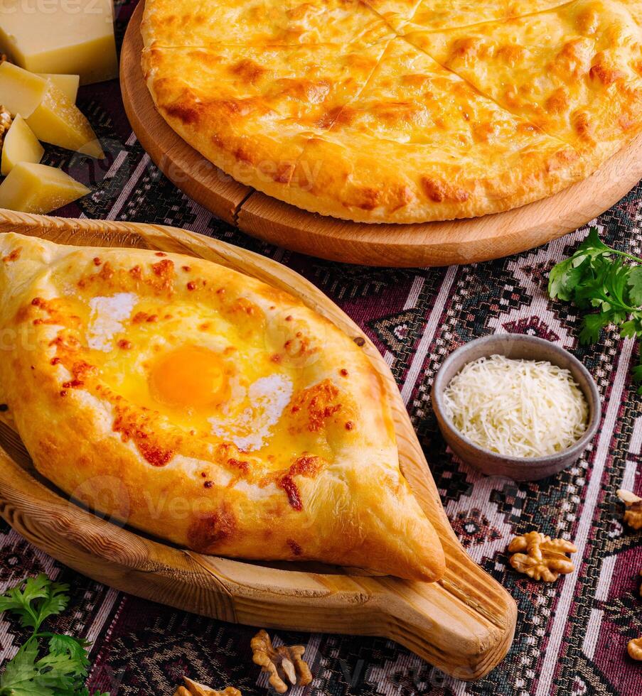 Traditional georgian cuisine khachapuri and pizza photo
