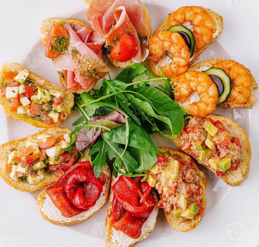 Gourmet bruschetta platter on white background photo