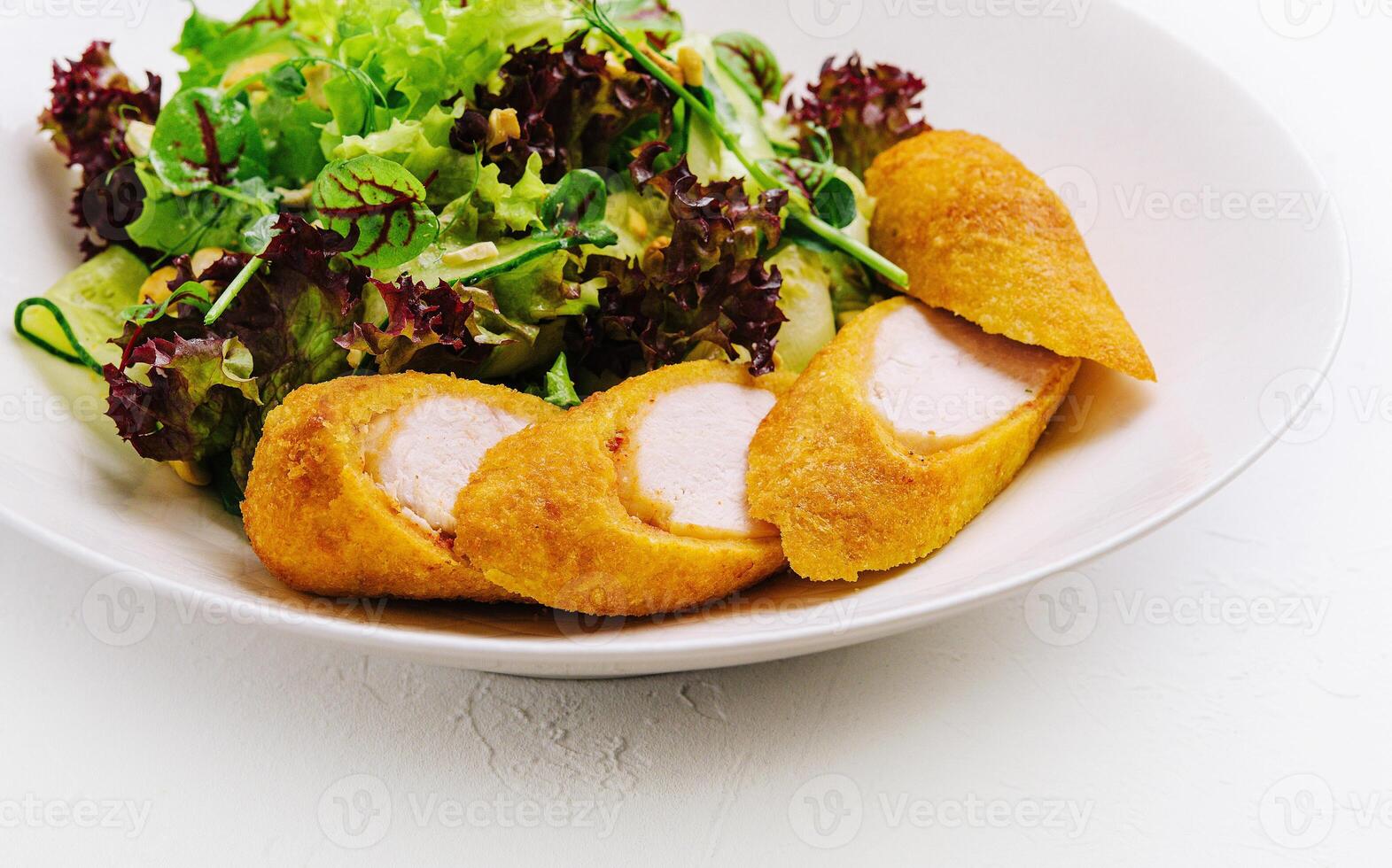 Chicken nuggets on a plate on white photo