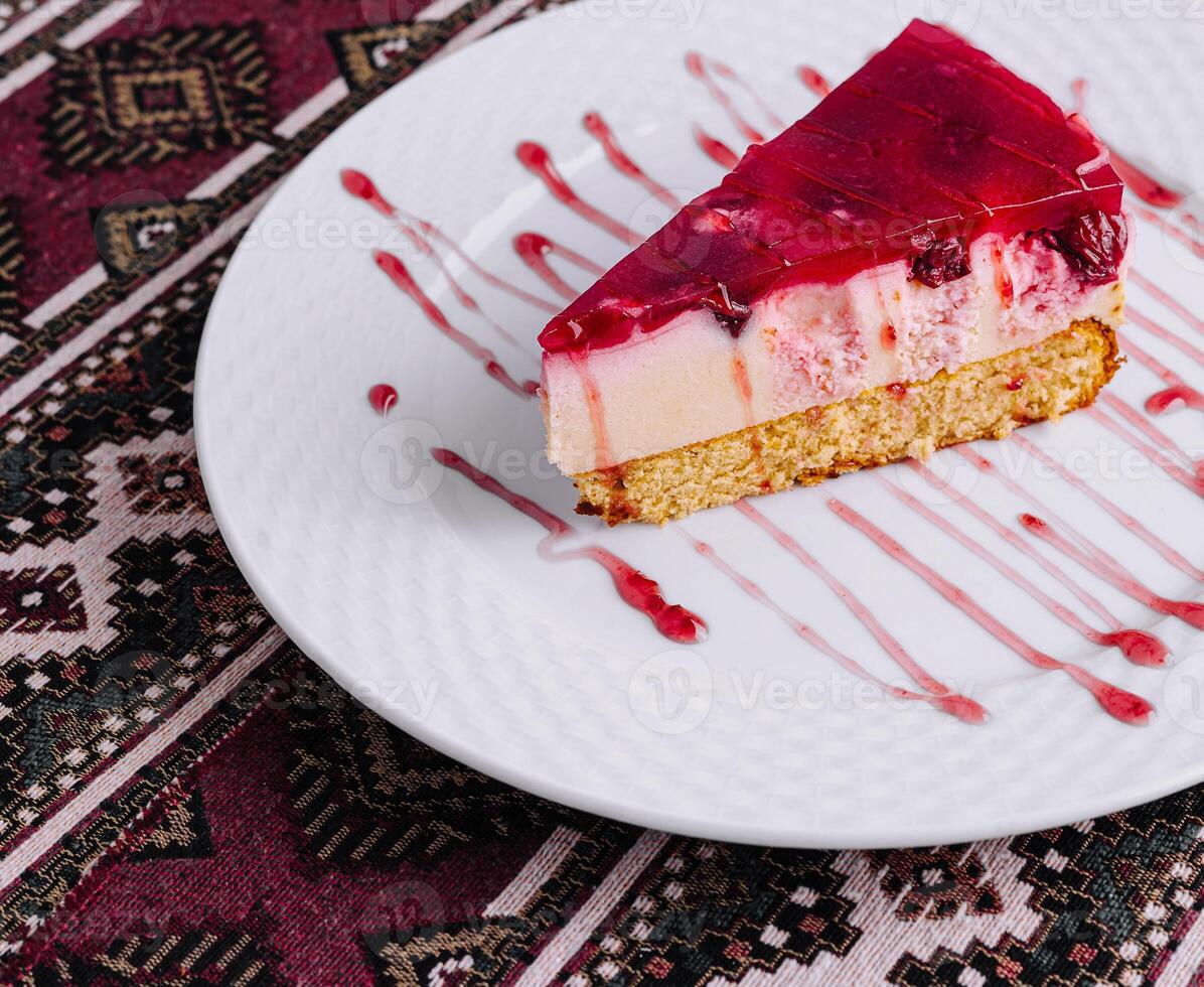 Delicious raspberry cheesecake slice on plate photo