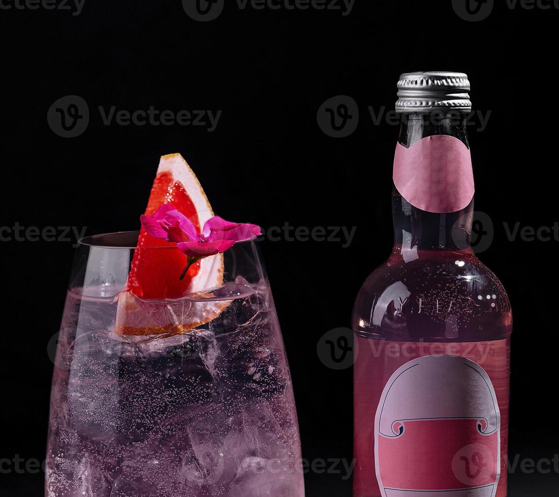 Refreshing pink gin tonic with grapefruit garnish photo