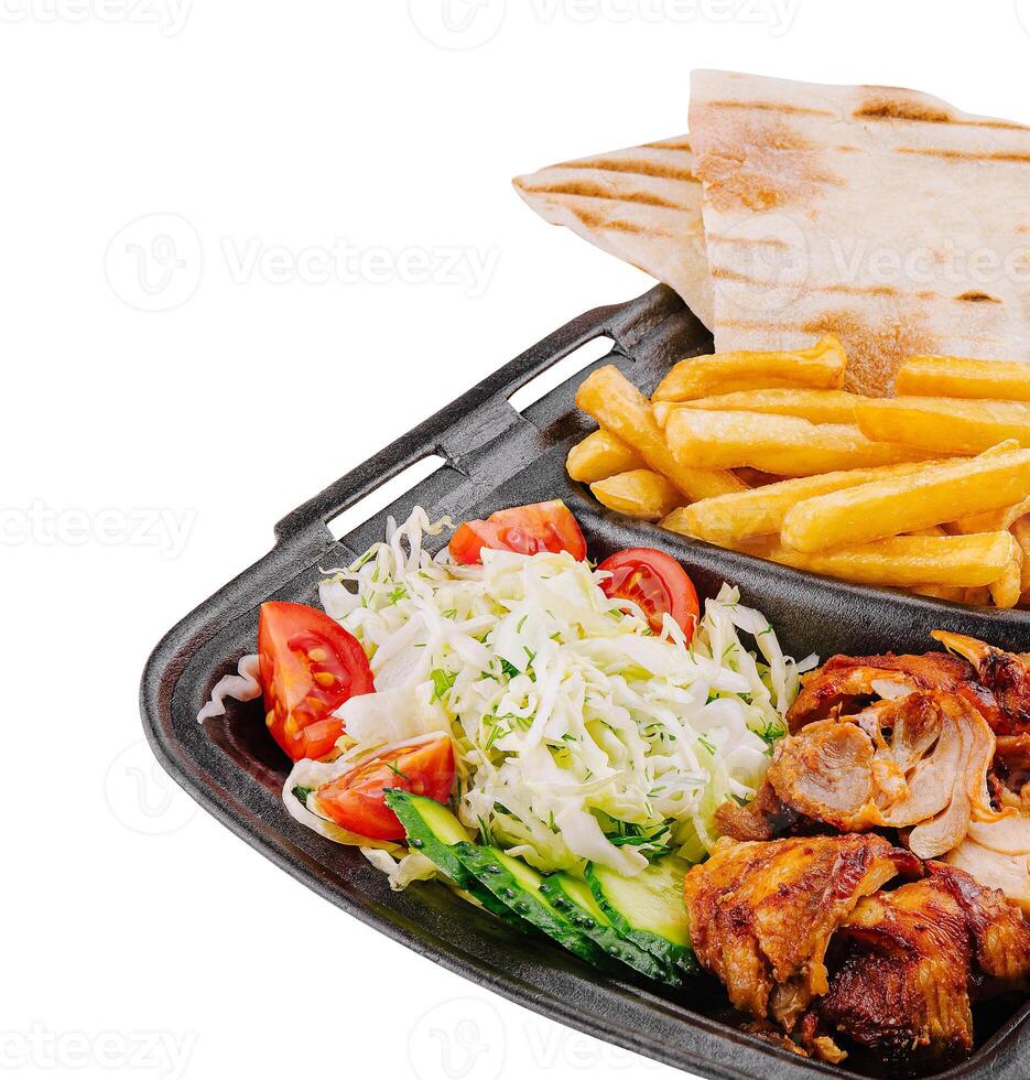 Gyro platter with fresh sides isolated on white photo