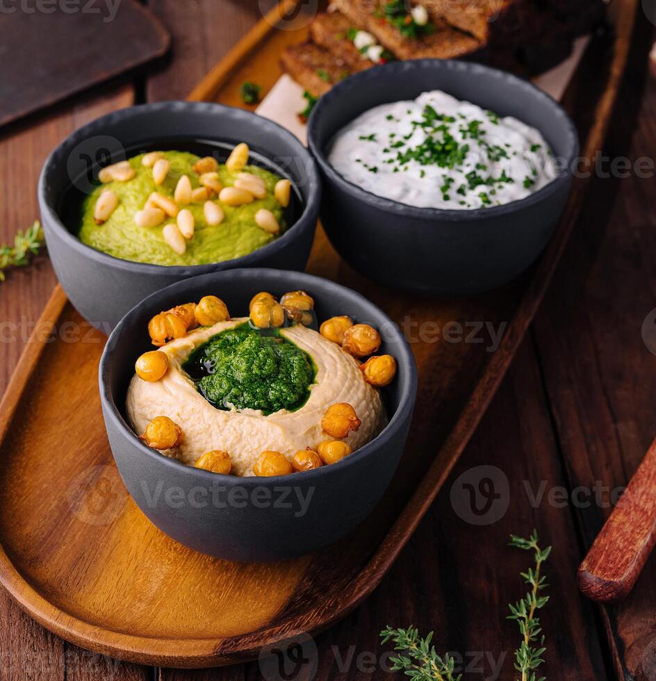 Gourmet beer snack platter with dips and toast photo