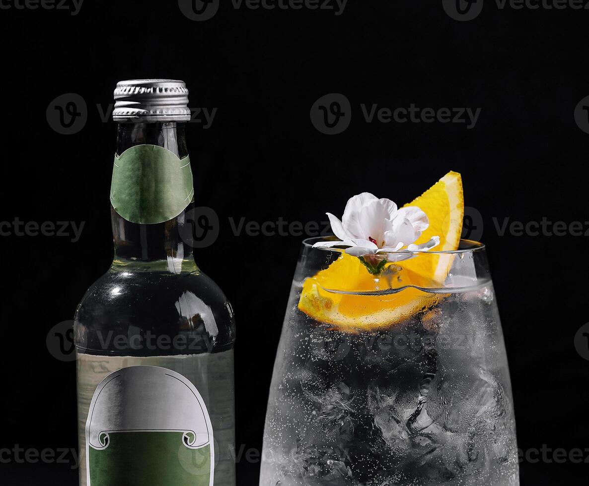 Refreshing gin and tonic cocktail with citrus garnish photo