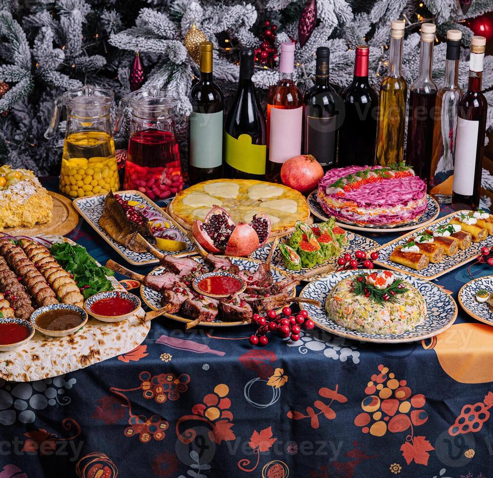 Festive holiday feast with decorated christmas tree photo