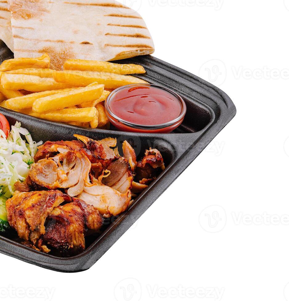 Gyro platter with fresh sides isolated on white photo