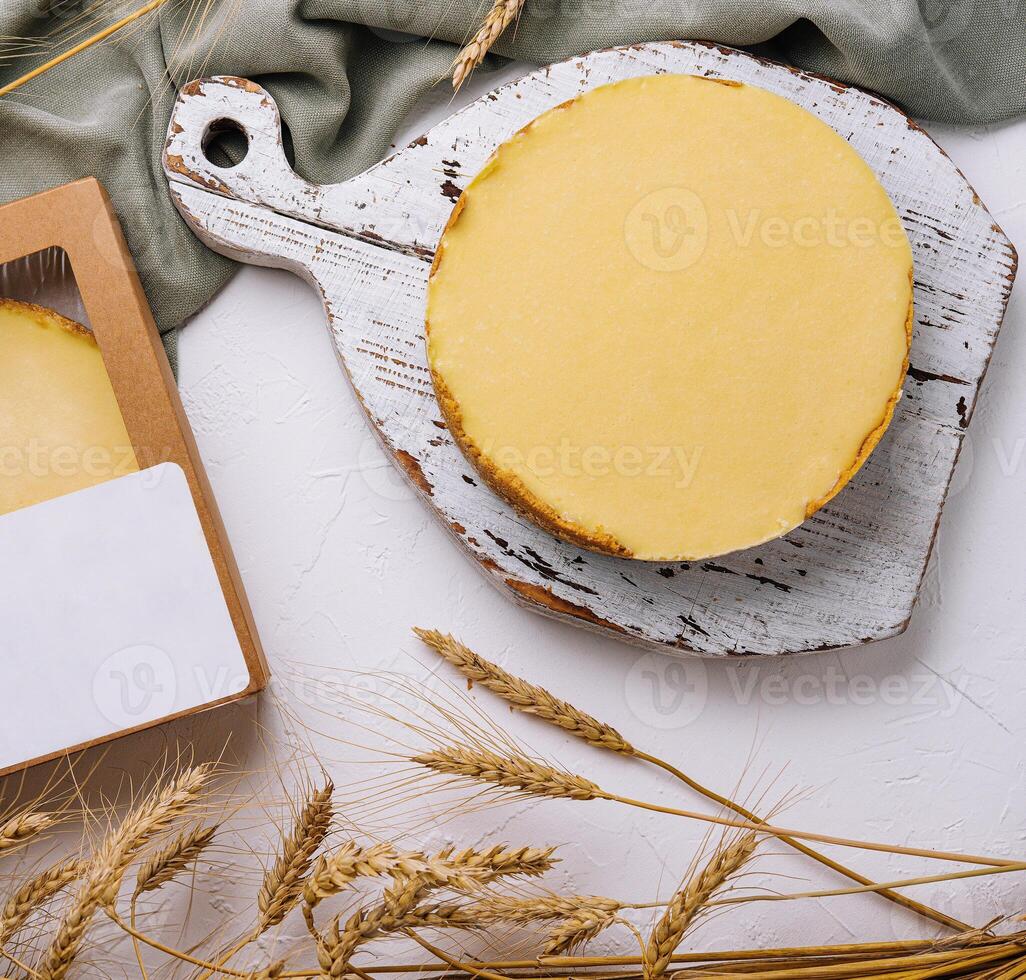 Homemade lemon tart on rustic kitchen setting photo