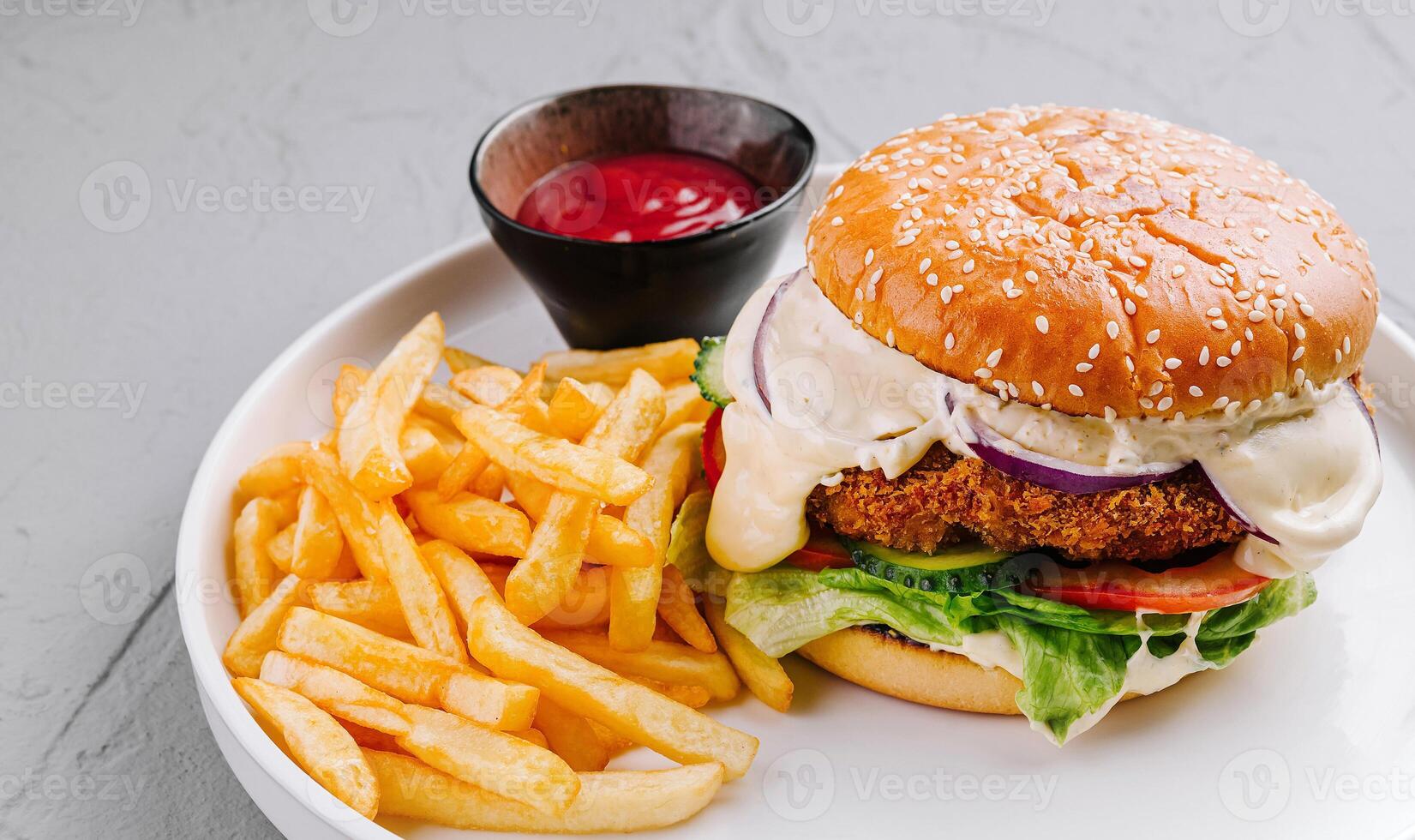Classic cheeseburger with fries and ketchup photo