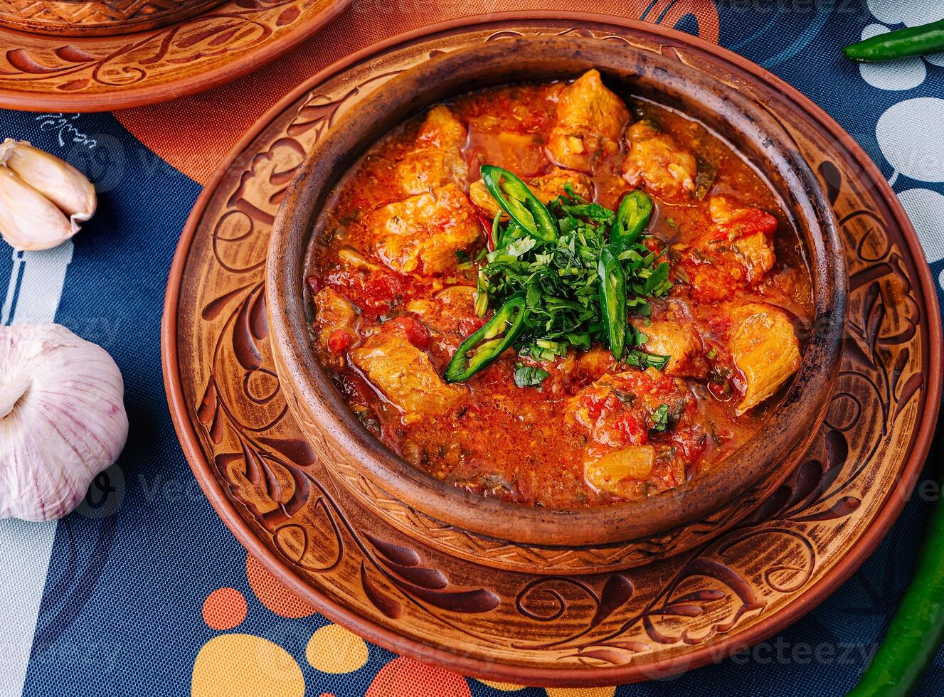 Traditional clay pot stews with herbs photo
