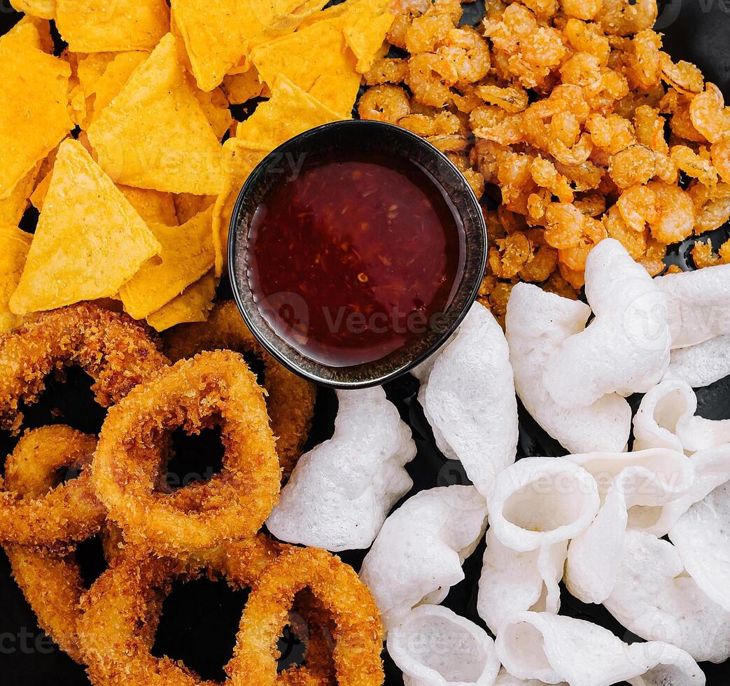 Assorted snack platter with dipping sauce photo
