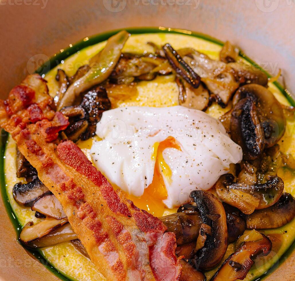 Gourmet breakfast with poached egg and bacon photo