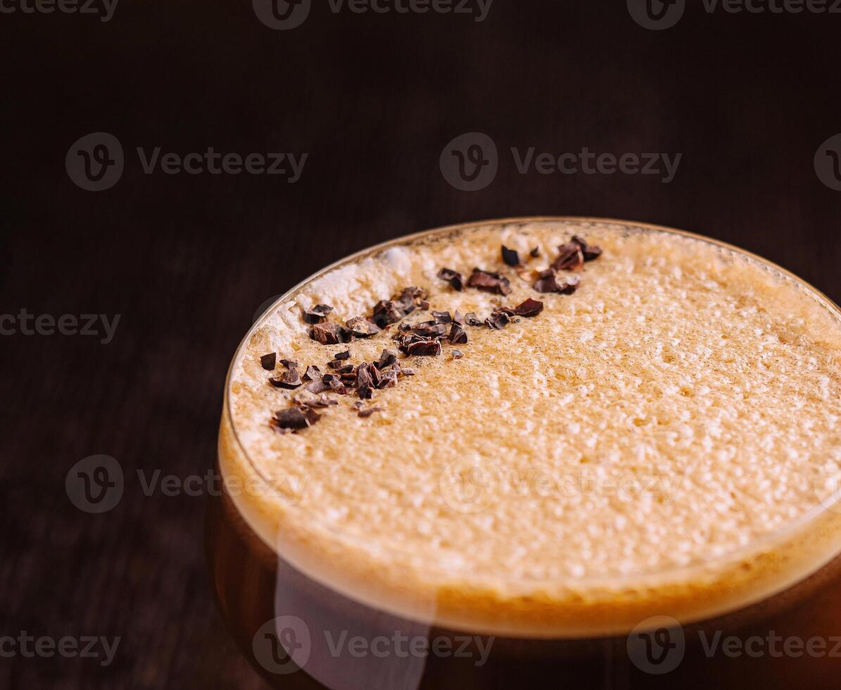 Elegant espresso martini cocktail on dark background photo