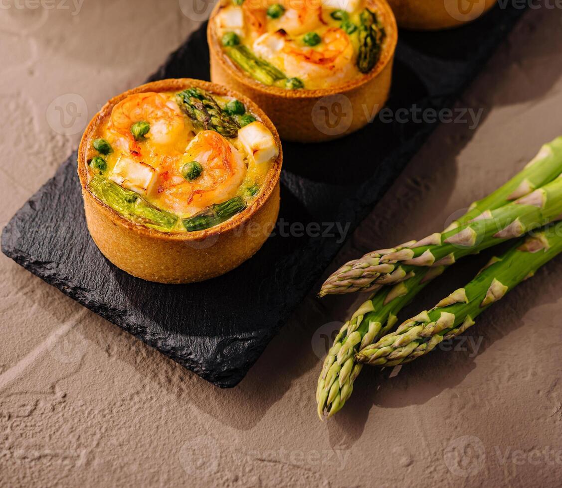 Savory mini quiches with asparagus top view photo