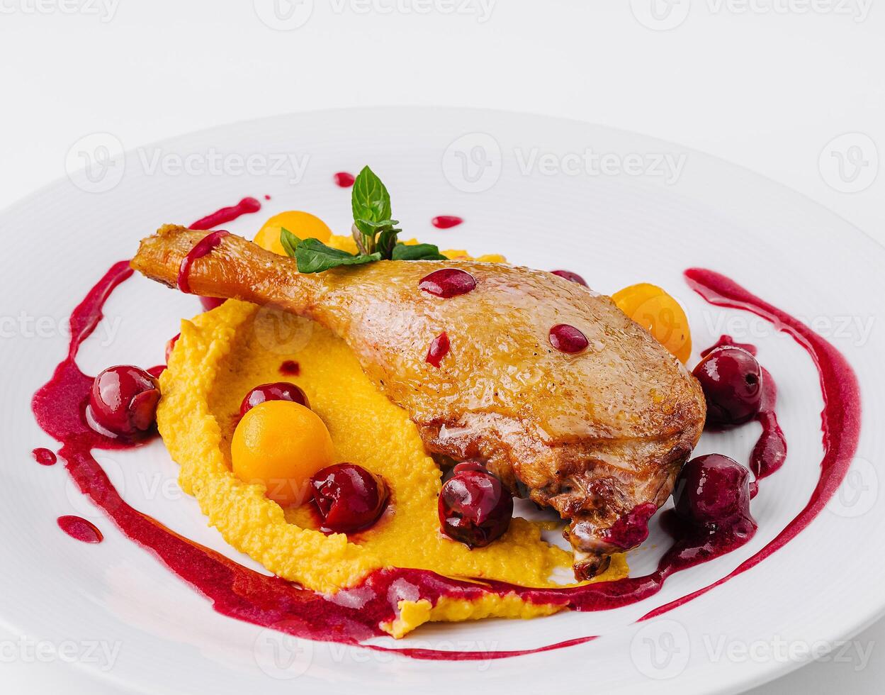 Gourmet duck confit with berry sauce photo